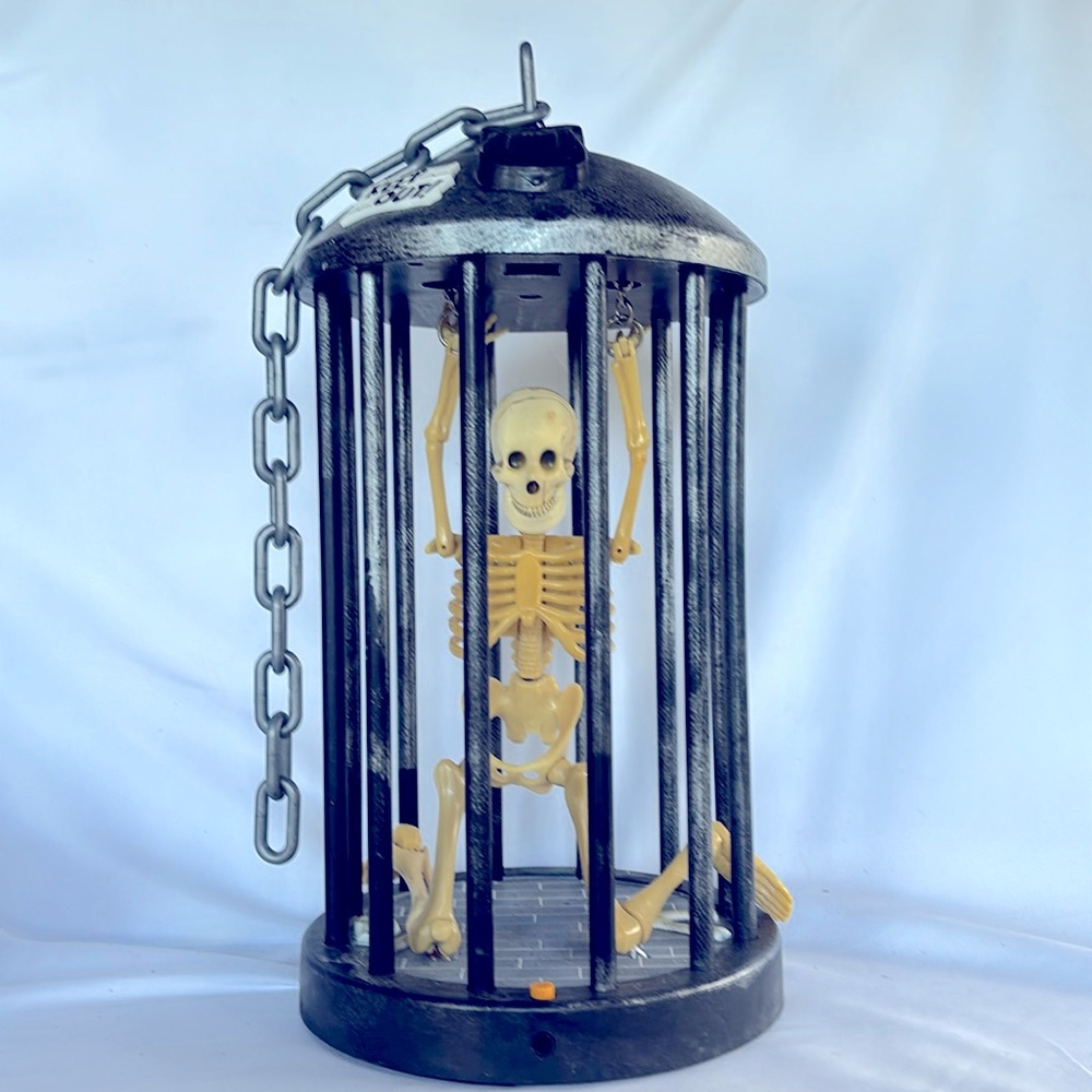 Gemmy Skeleton In The Cage Halloween Decor . Used In Good Condition. Grey Color